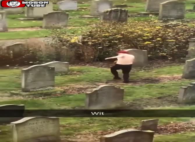 Video :She does an odd dance at a graveyard while wearing a bra